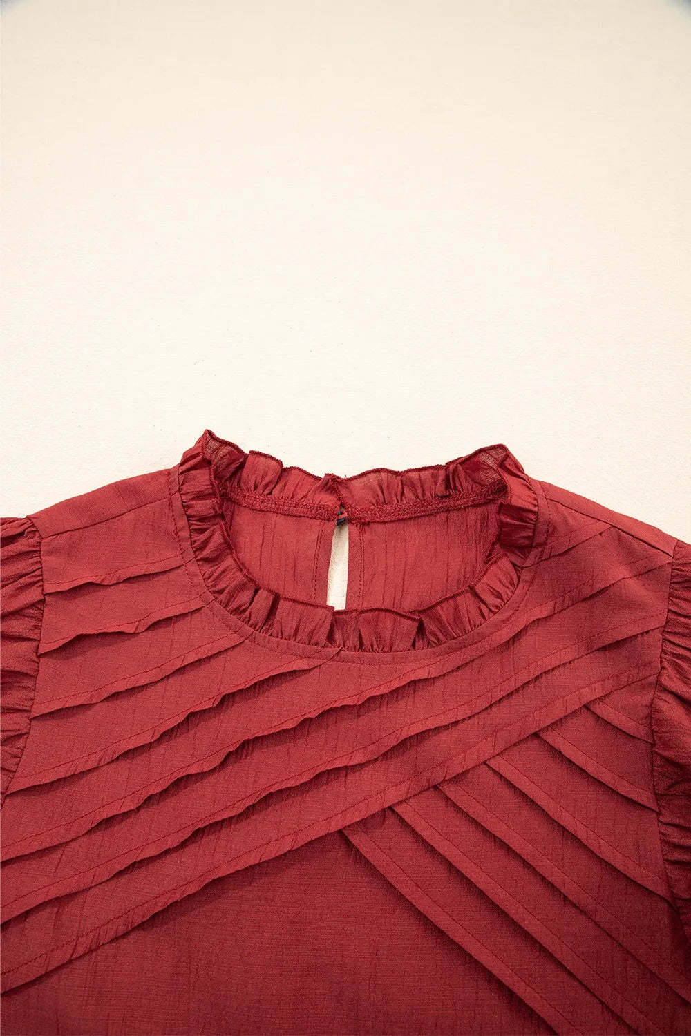 Dahlia Solid Color Pleated Detail Ruffle Short Sleeve Blouse