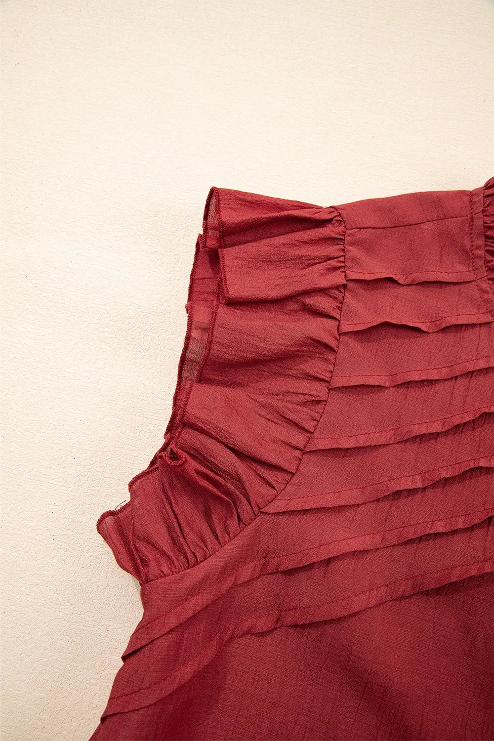 Dahlia Solid Color Pleated Detail Ruffle Short Sleeve Blouse