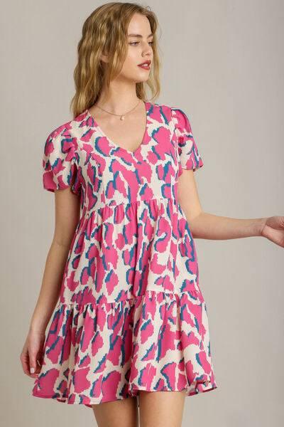 Umgee Full Size Abstract Print Pleat Detail Short Sleeve V-Neck Tiered Dress Plus Size