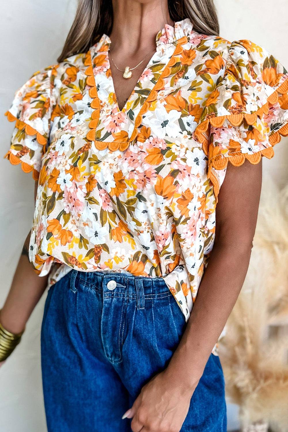 Ruffled Notched Short Sleeve Floral Blouse