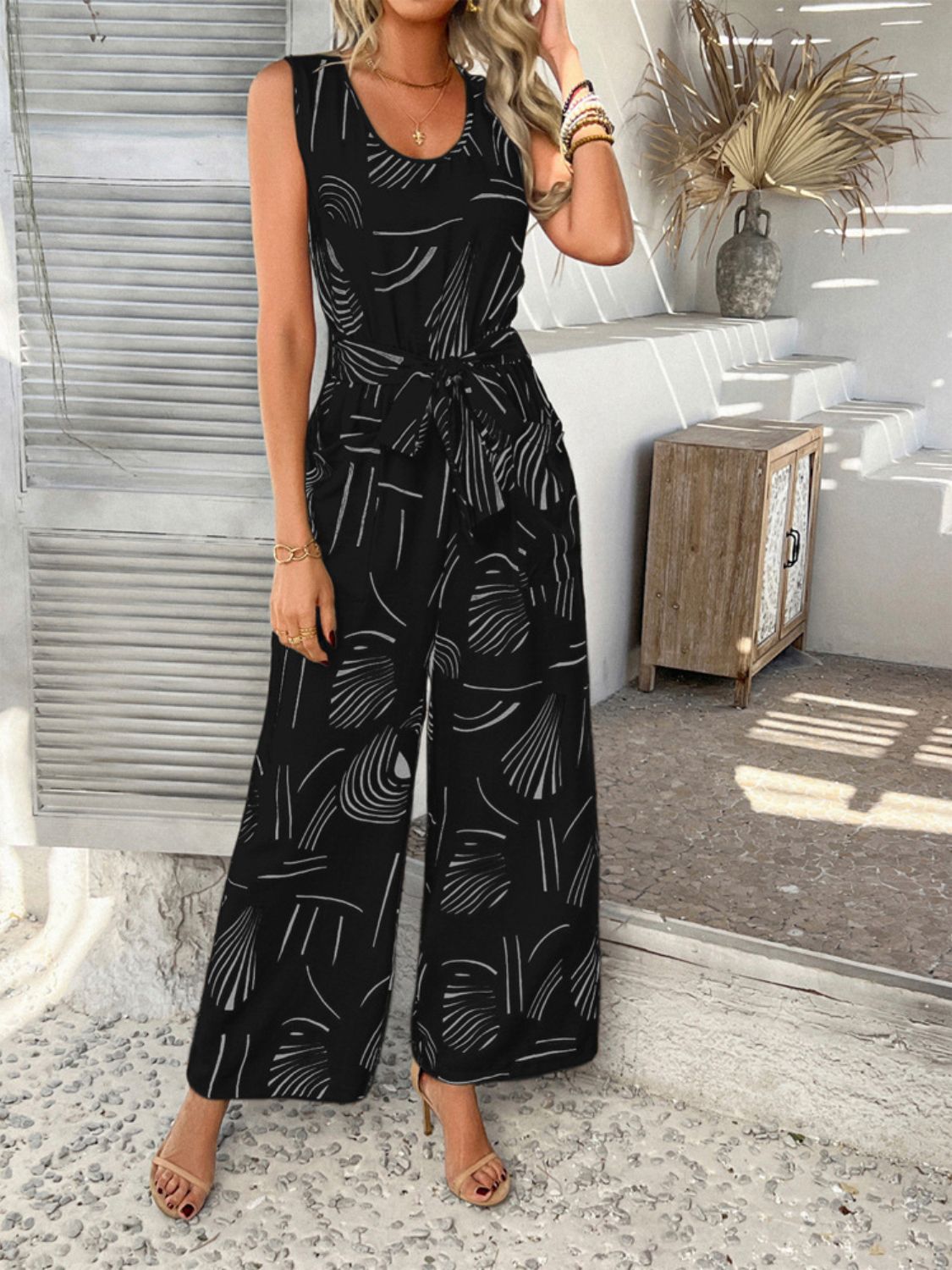 Devine Printed Round Neck Sleeveless Tie Waist Jumpsuit